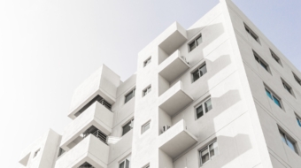 low-angle-shot-facade-white-modern-building-blue-clear-sky